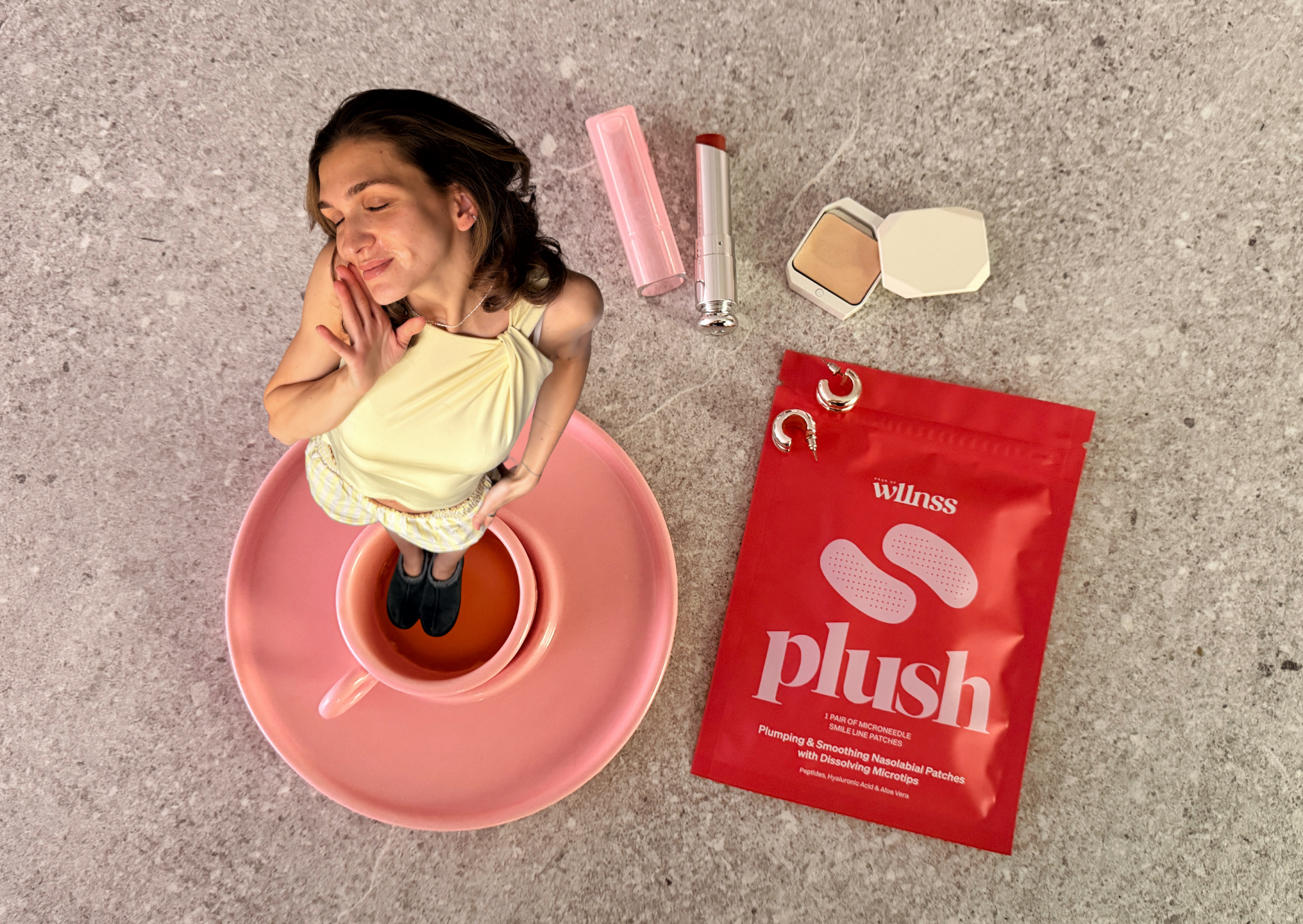 girl eating cherries, wearing heart-shaped microneedle spot patches